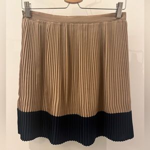 Tan pleated short skirt, dark blue hem, size S